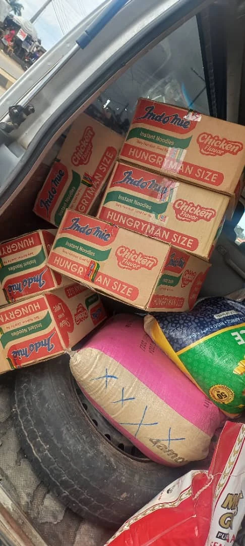 Boxes of noodles and bags of rice loaded for delivery