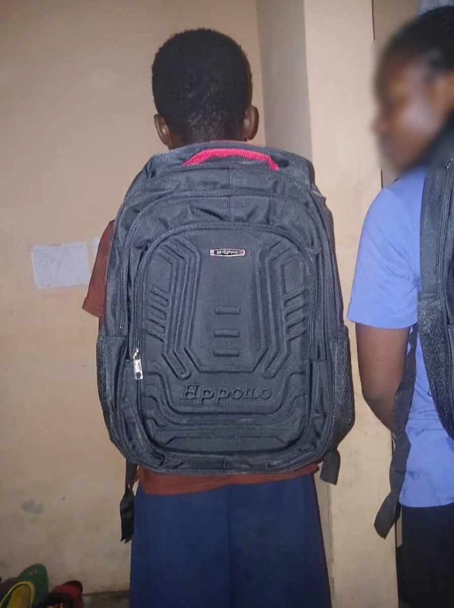 Pupil wearing a new school bag donated by the Initiative